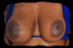 Hi I am trish. I am an afro american female with big black breasts. My areola is bigger than a silver dollar. I also have sexy firm black nipples that puff out at men.